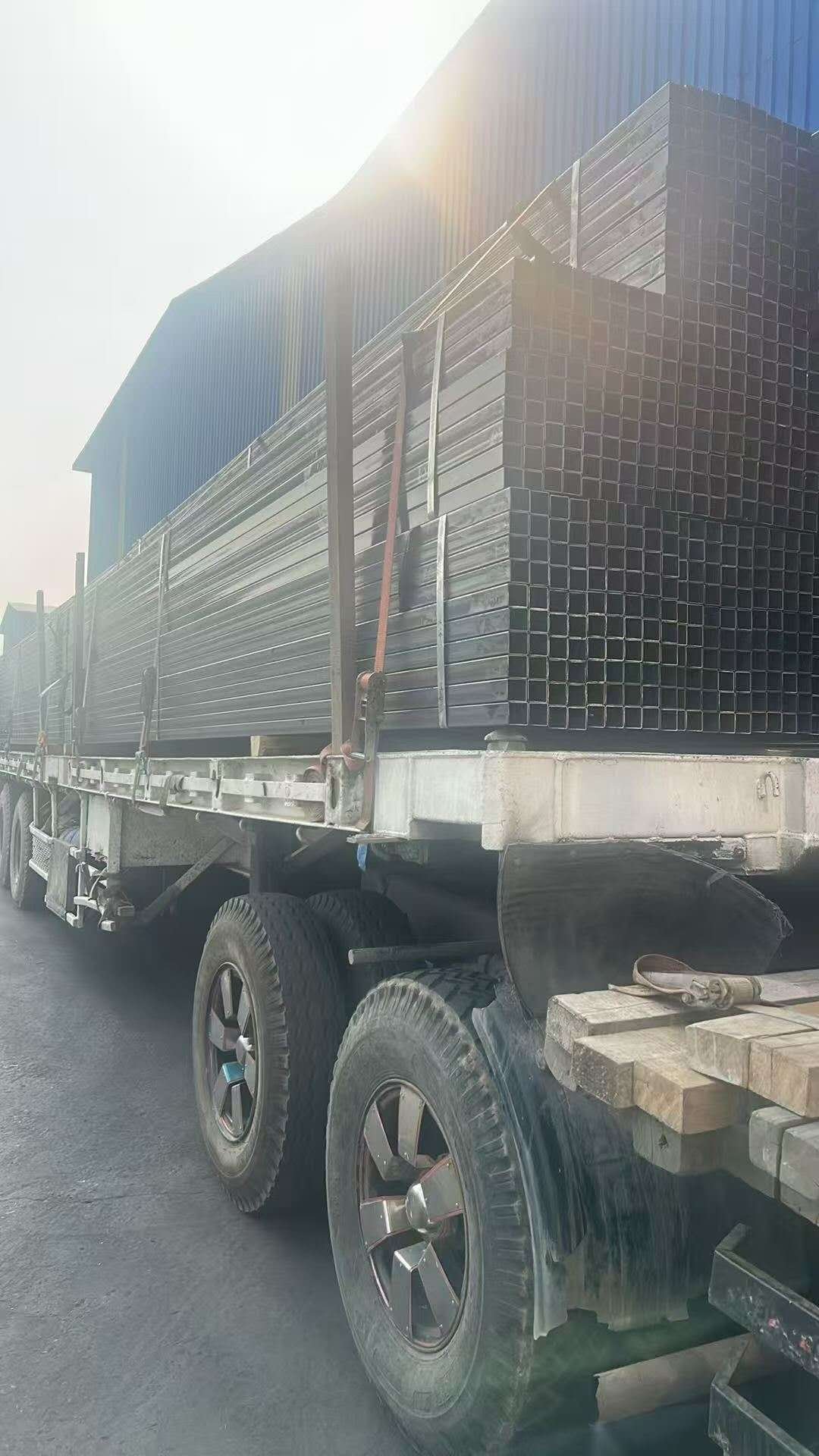 A truck carrying bundled hollow steel sections