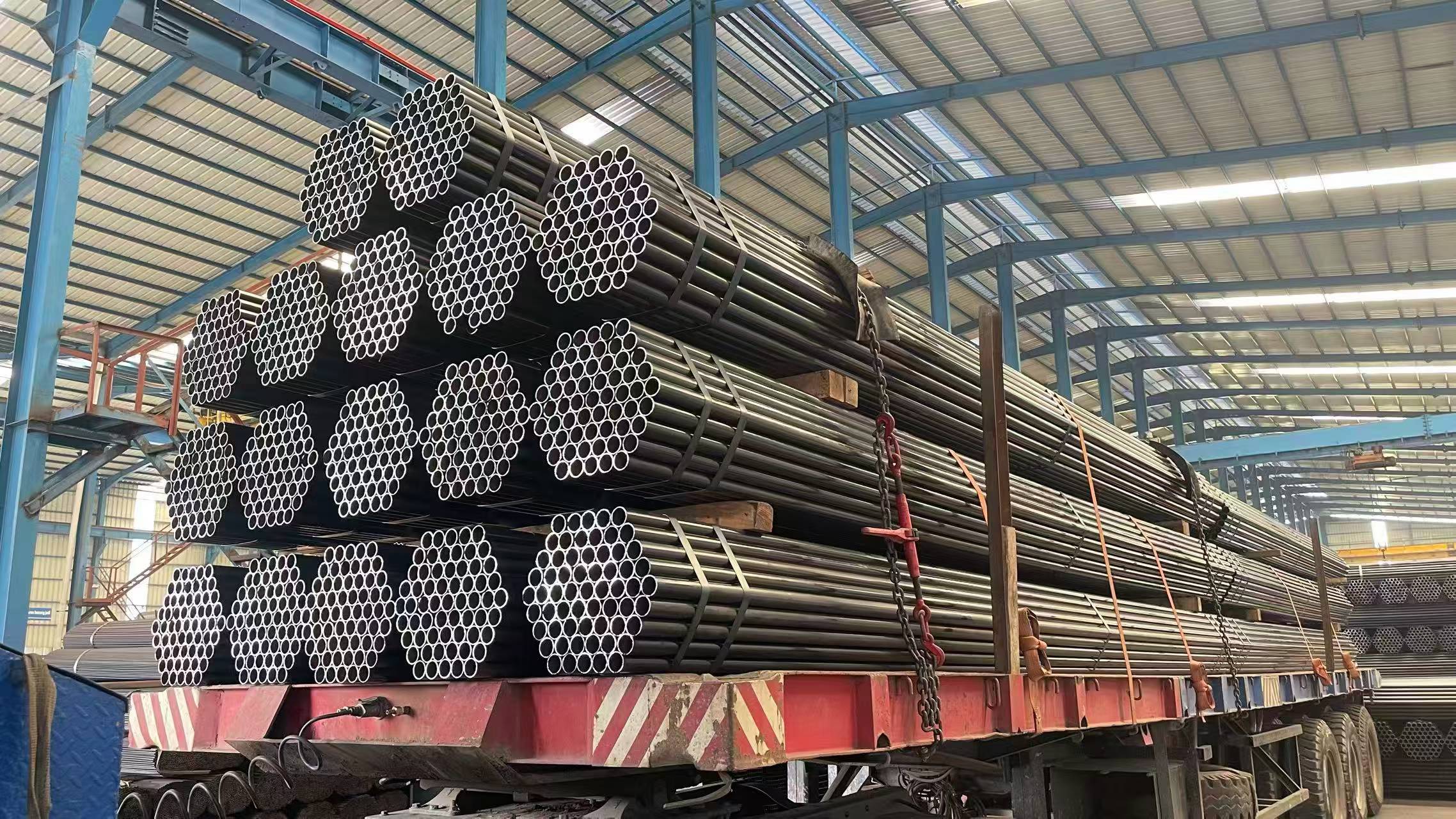 Round steel pipes secured on a delivery truck